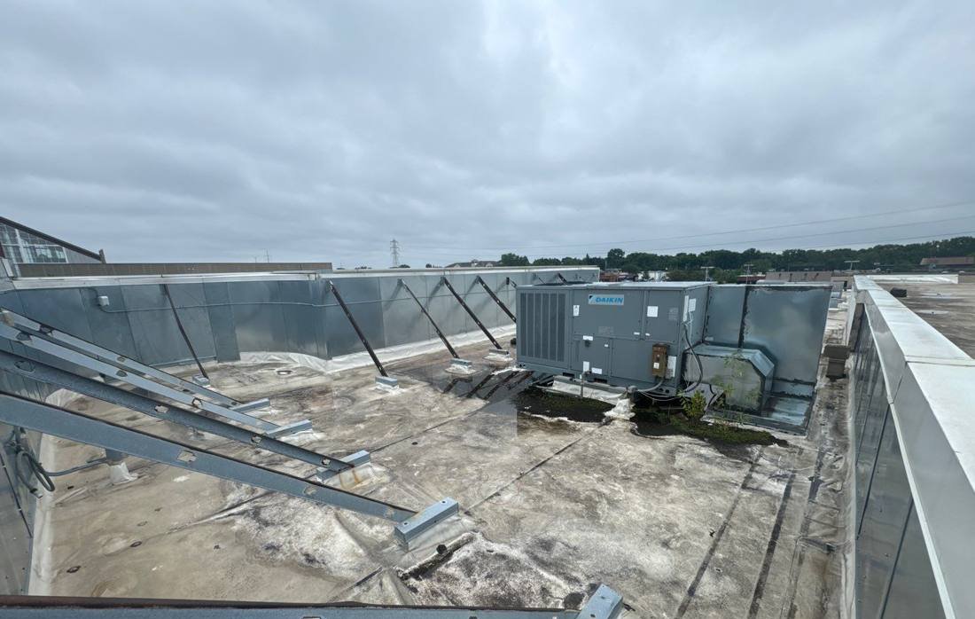 Rooftop HVAC unit and equipment supports on the Bloomington Lincoln roof, July 2024