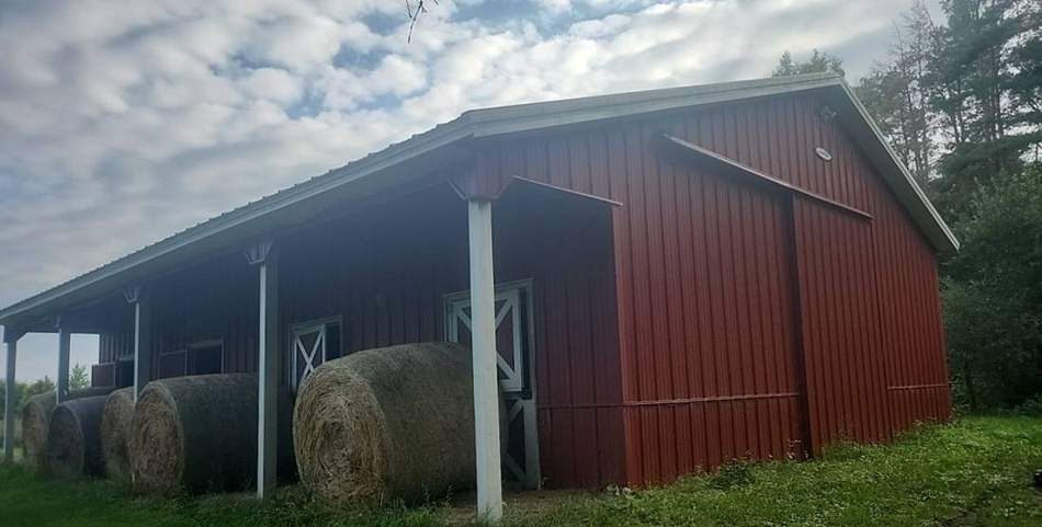 Pole barn near Northfield with a metal roof Repair King inspected for hail damage, July 2023