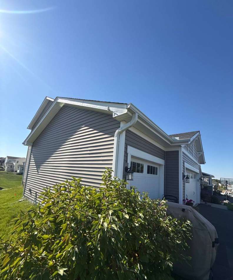 Two-story home near 71st Street in Inver Grove Heights photographed during a roof and siding inspection, October 2025