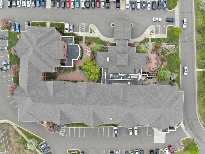 Straight-down drone view of the Hilton Garden Inn roof and parking lots in Maple Grove, MN, May 2019