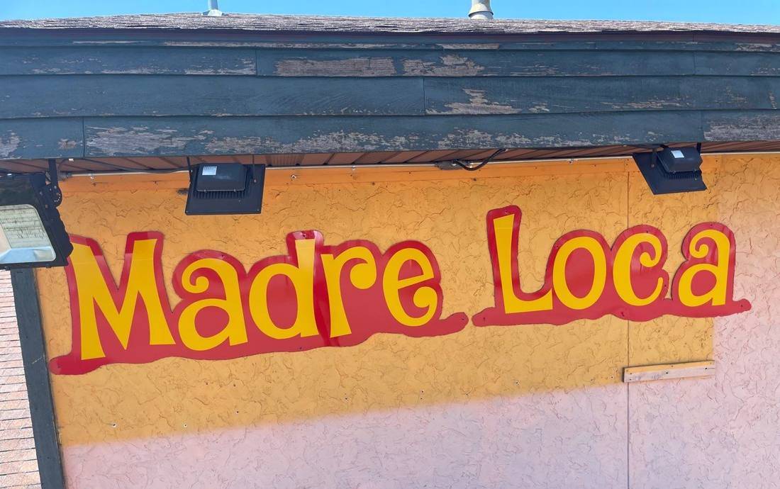 The Madre Loca sign on the restaurant's exterior wall in Princeton, May 2022