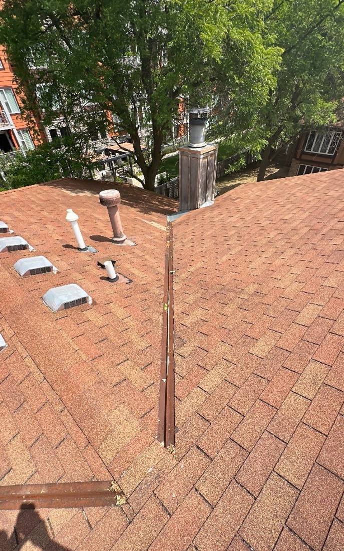 Roof valley and vent stack on a Prior Lake multi-family building, July 2023