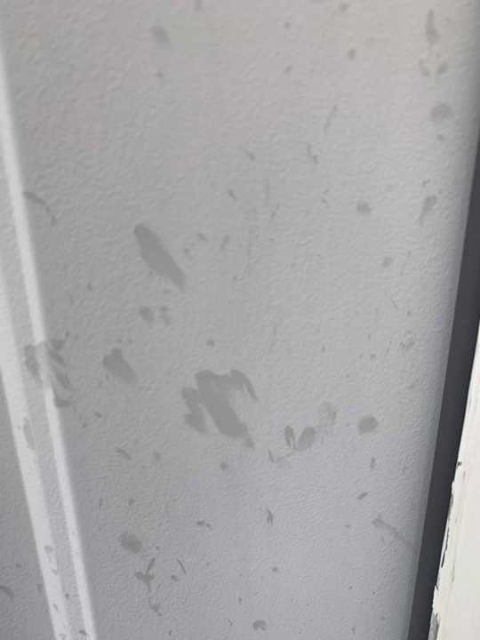 Hail spatter marks on a painted door on a north Maple Grove home, September 2019