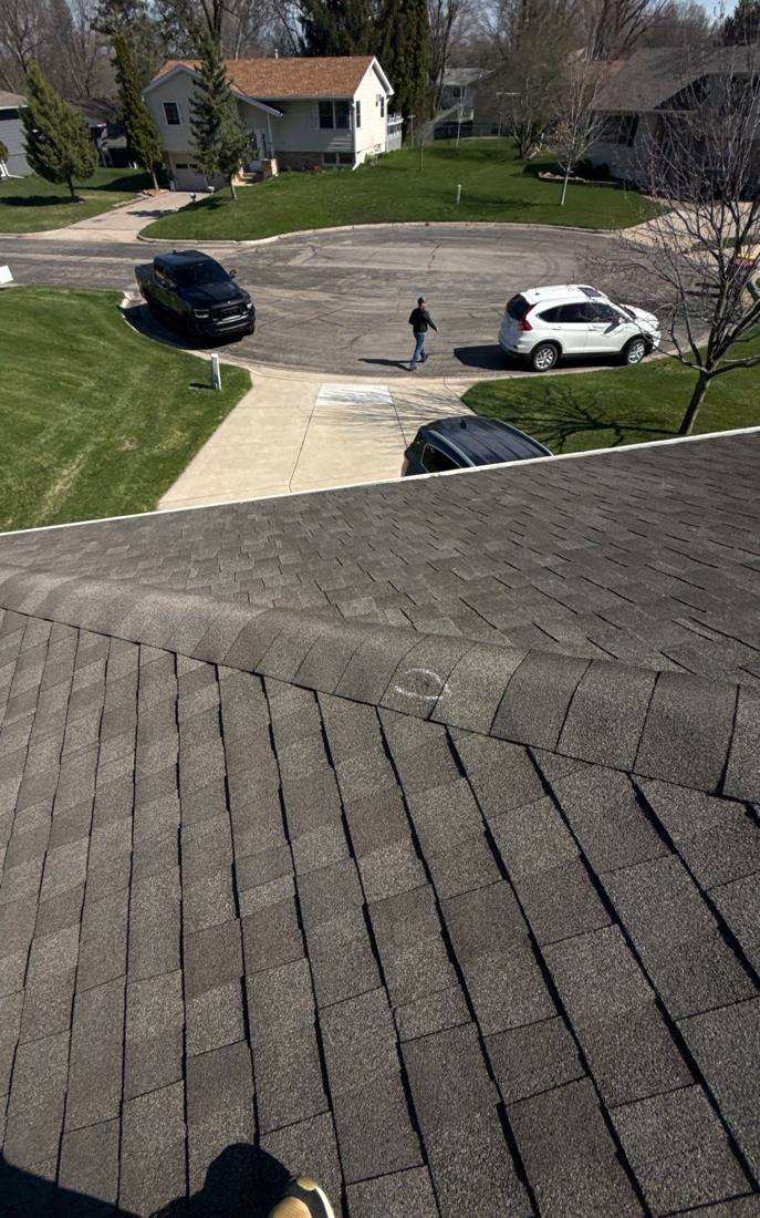 Aerial view of a Faribault cul-de-sac during a roof inspection, April 2026
