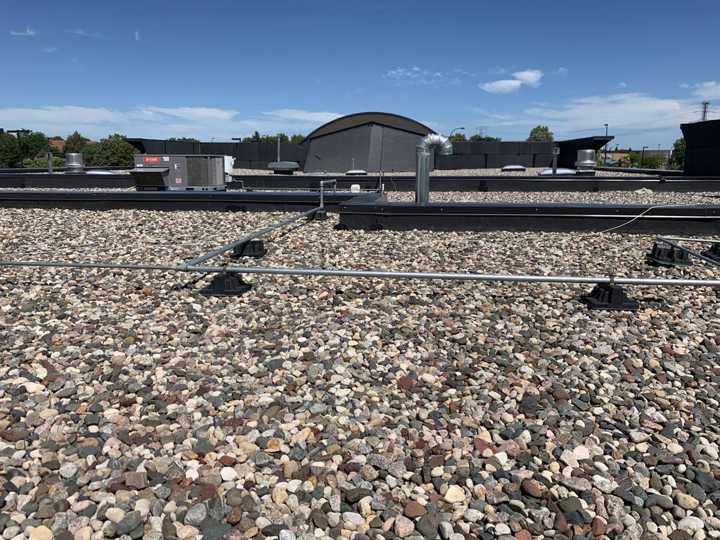 Ballasted rubber roof and the curved roof feature at Paradise Car Wash in Maple Grove, MN, August 2019