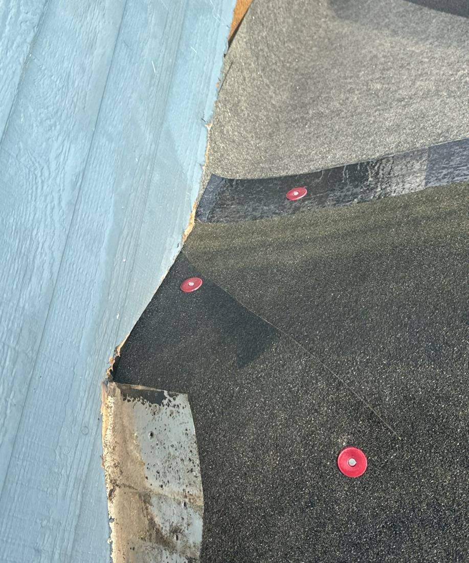 Roof valley and ice-and-water shield detail on a Burnsville tear-off, December 2023