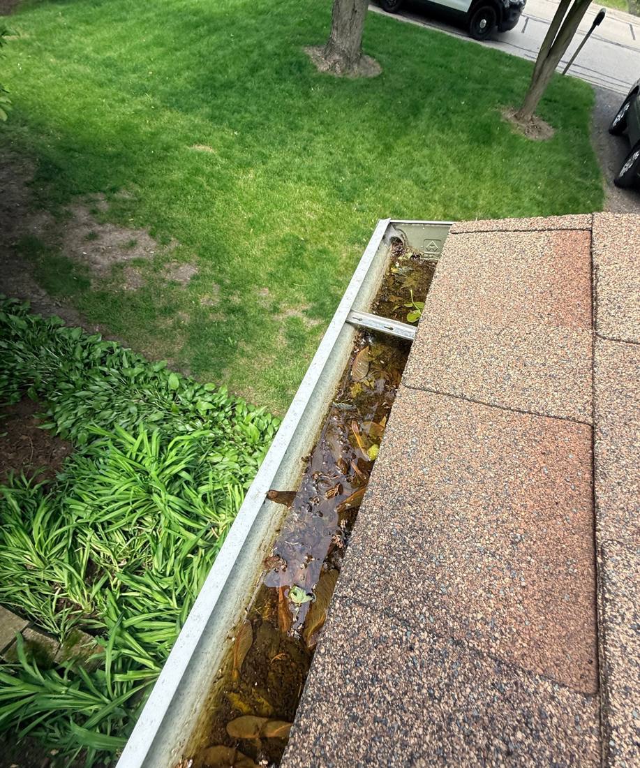 Gutter run checked for hail dents on a Darien inspection, May 2026