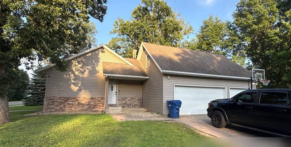 Two-story home in St. Cloud photographed during a roof inspection, July 2026