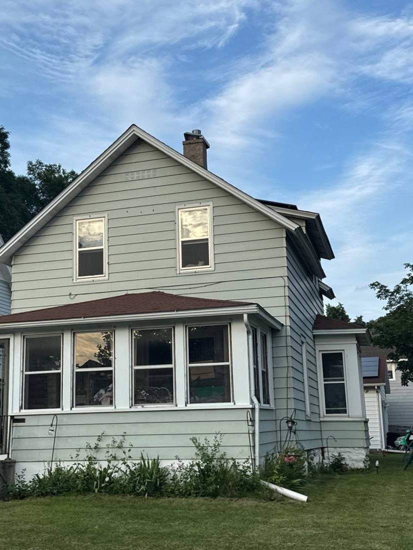 Two-story home in Winona photographed during a roof project, July 2024