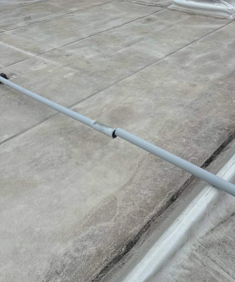 Long run of the old Bloomington Lincoln roof with a conduit line across it, July 2024