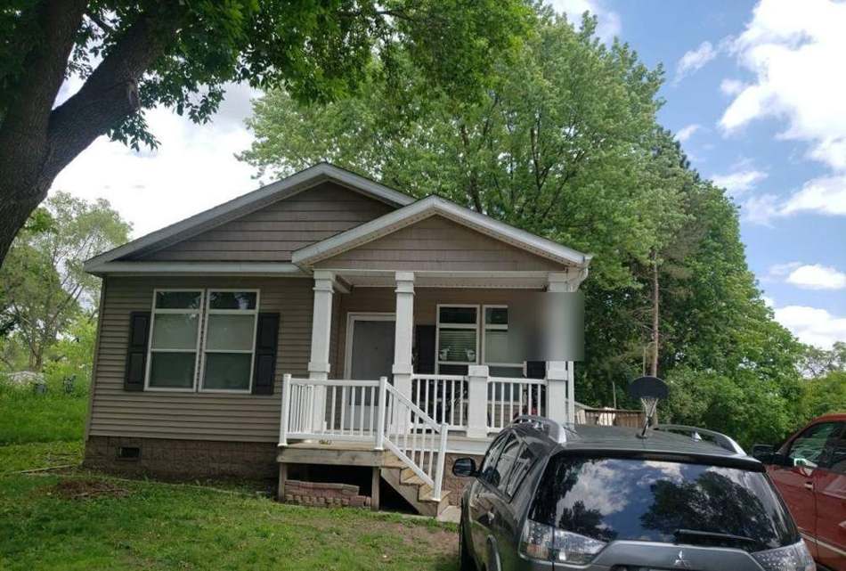 Two-story home in Lake Elmo photographed during a roof inspection, June 2022