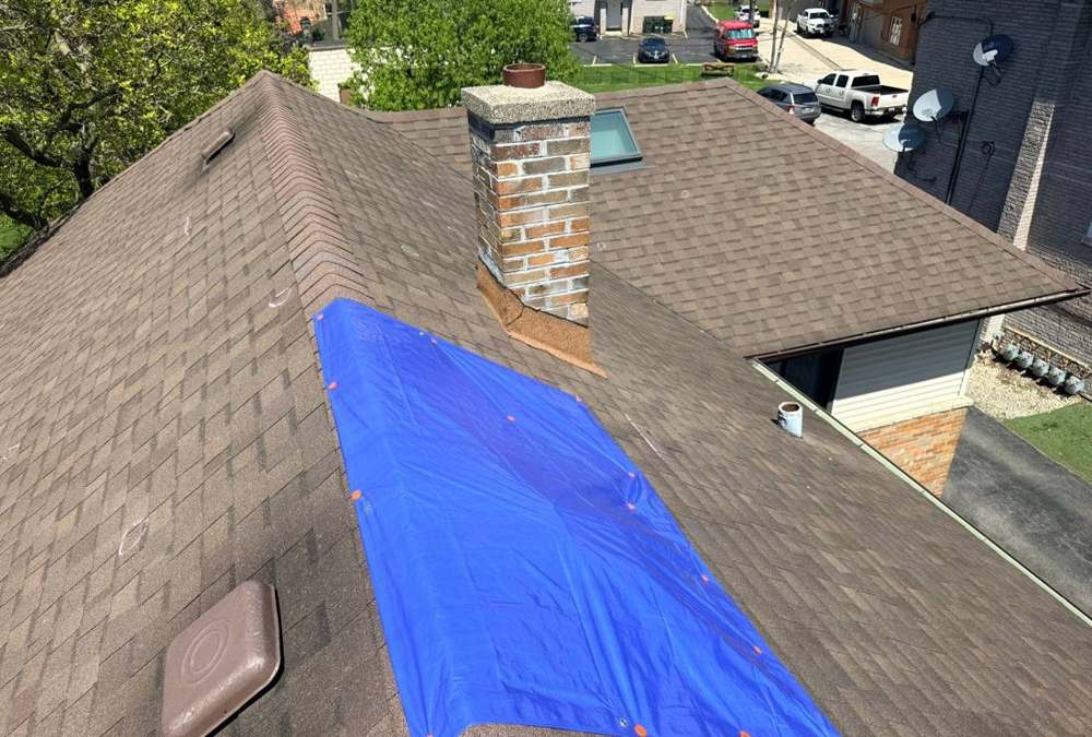 Repair King crew documented a tarped roof section during a Riverside inspection, April 2026