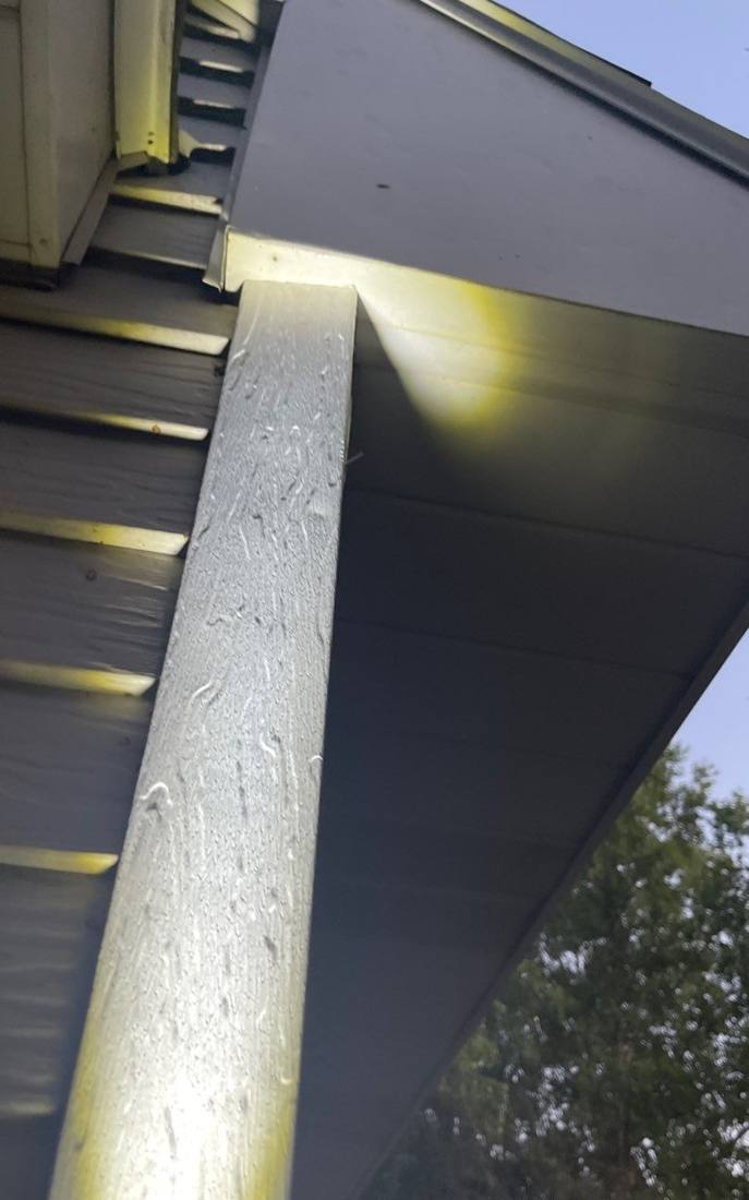 Hail-dented bent metal fascia found during a Pine Island inspection, August 2022