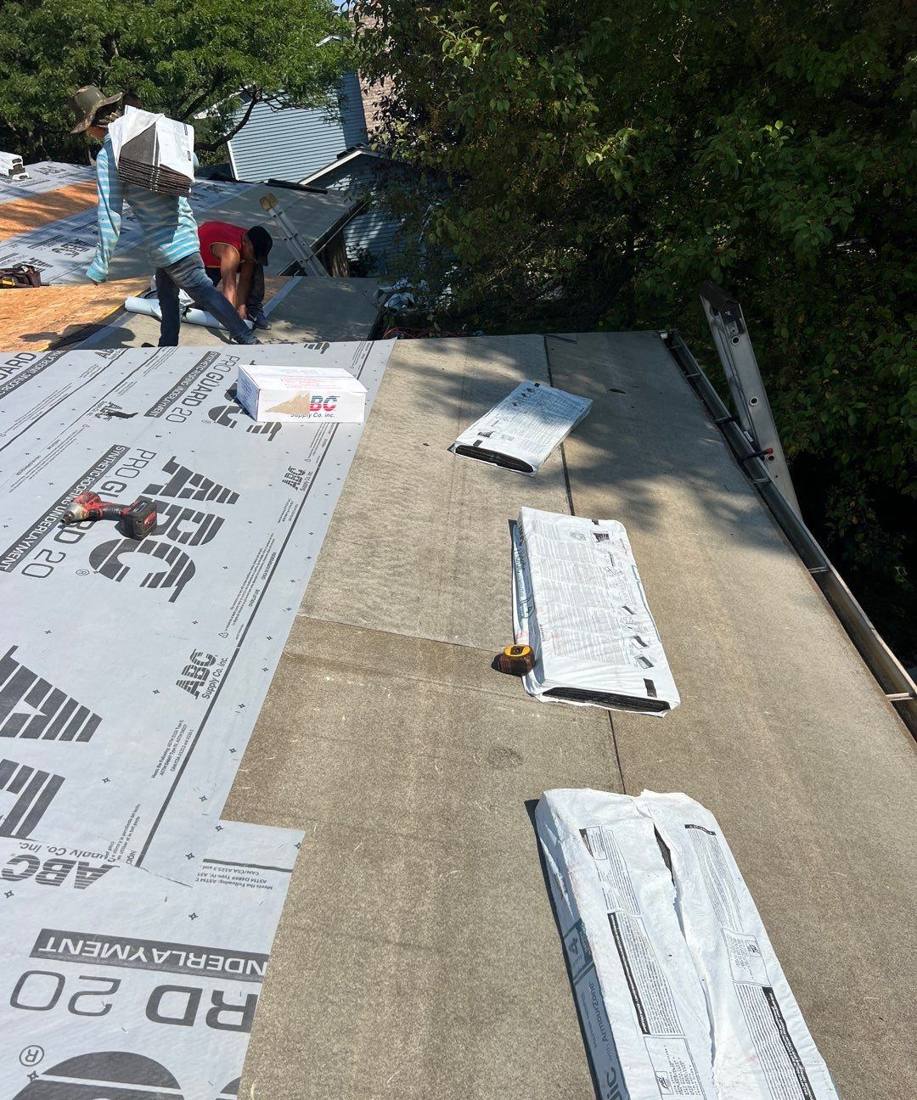 Tear-off day in Woodbury: new synthetic underlayment going down, August 2024