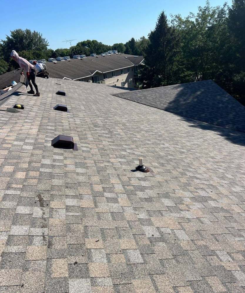 Finished shingles and new box vents along the Ridgedale Square roof in Hutchinson, August 2024