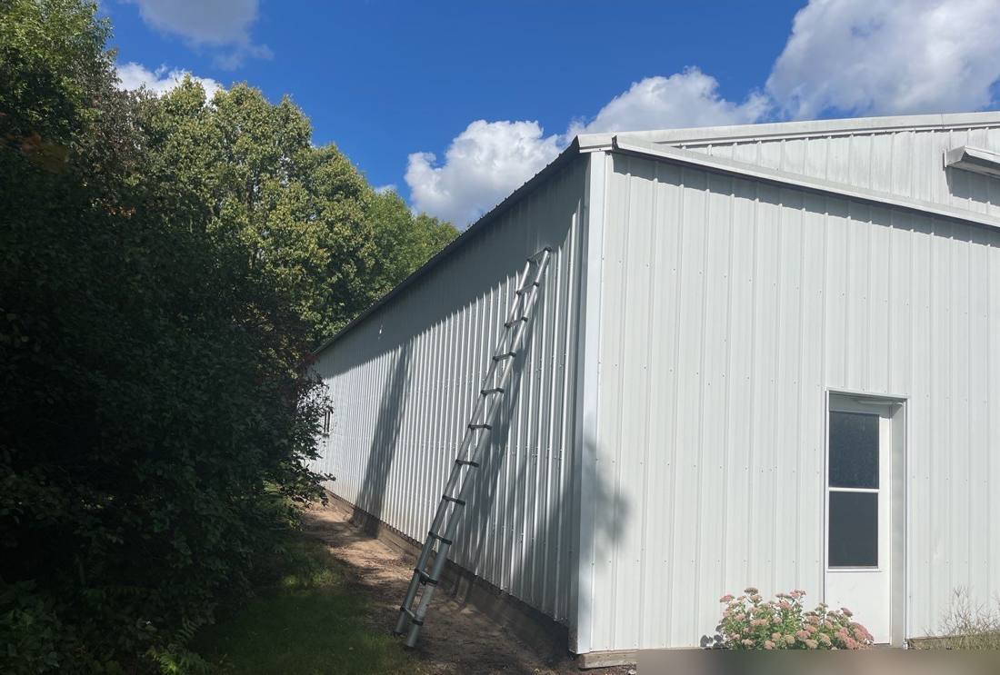 Pole-barn shop building near Royalton photographed during a roof inspection, September 2021