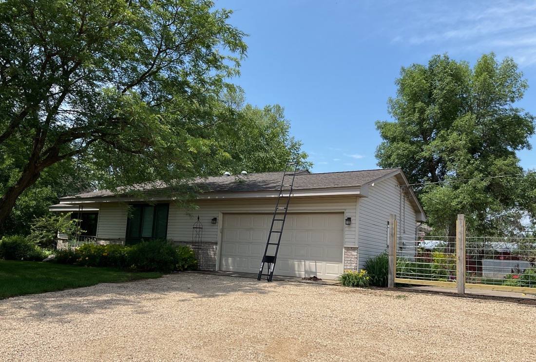 Ranch-style home on a Farmington acreage during a roof inspection, July 2023