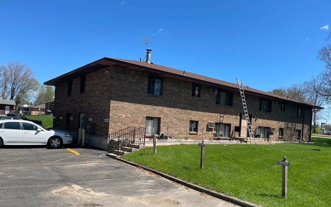 Candy Cross Apartments, a two-story brick apartment building in Princeton, MN, photographed by Repair King during a roof inspection, May 2022