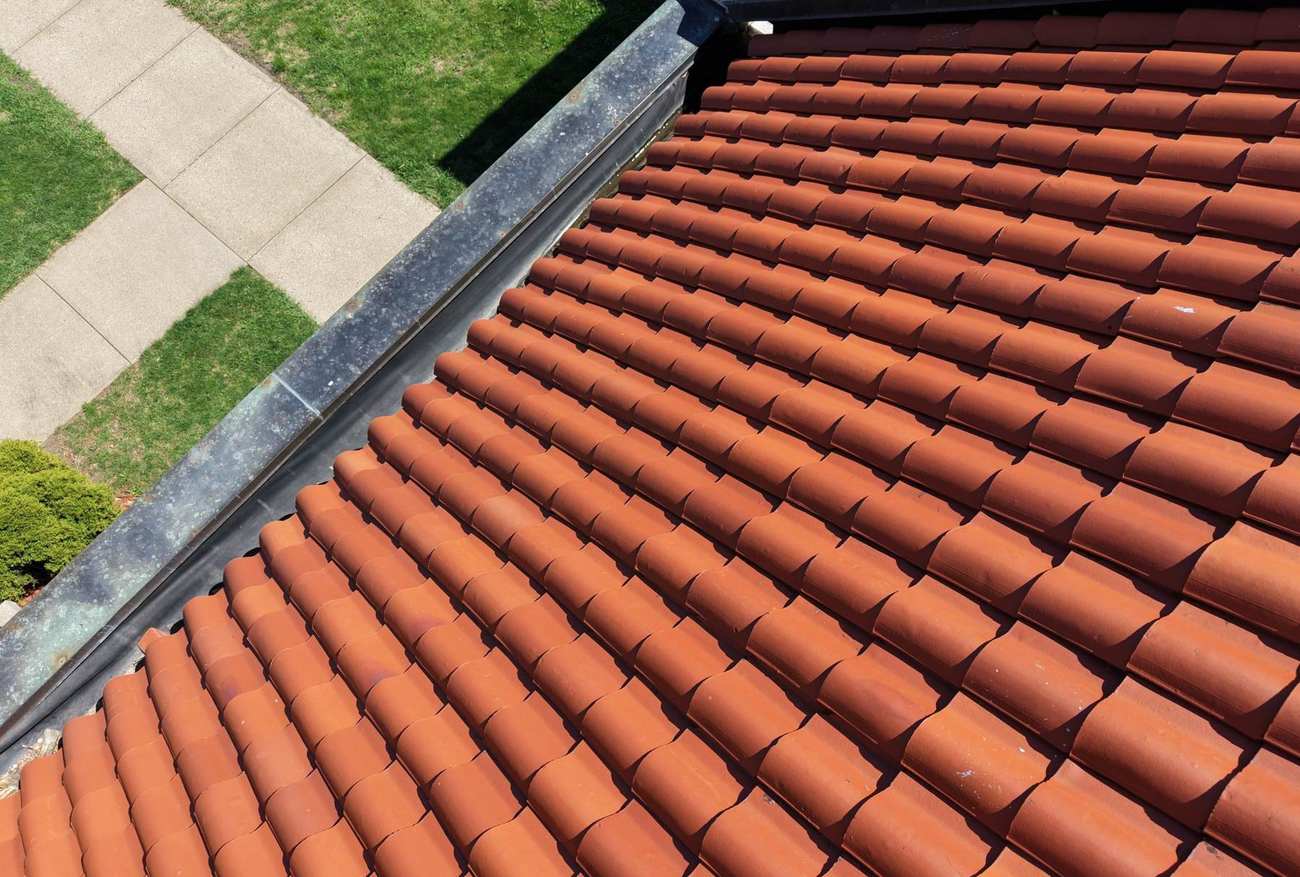 Aerial view of the red clay tile roof on The River Church building on 4th Ave NW in Faribault, MN, April 2026