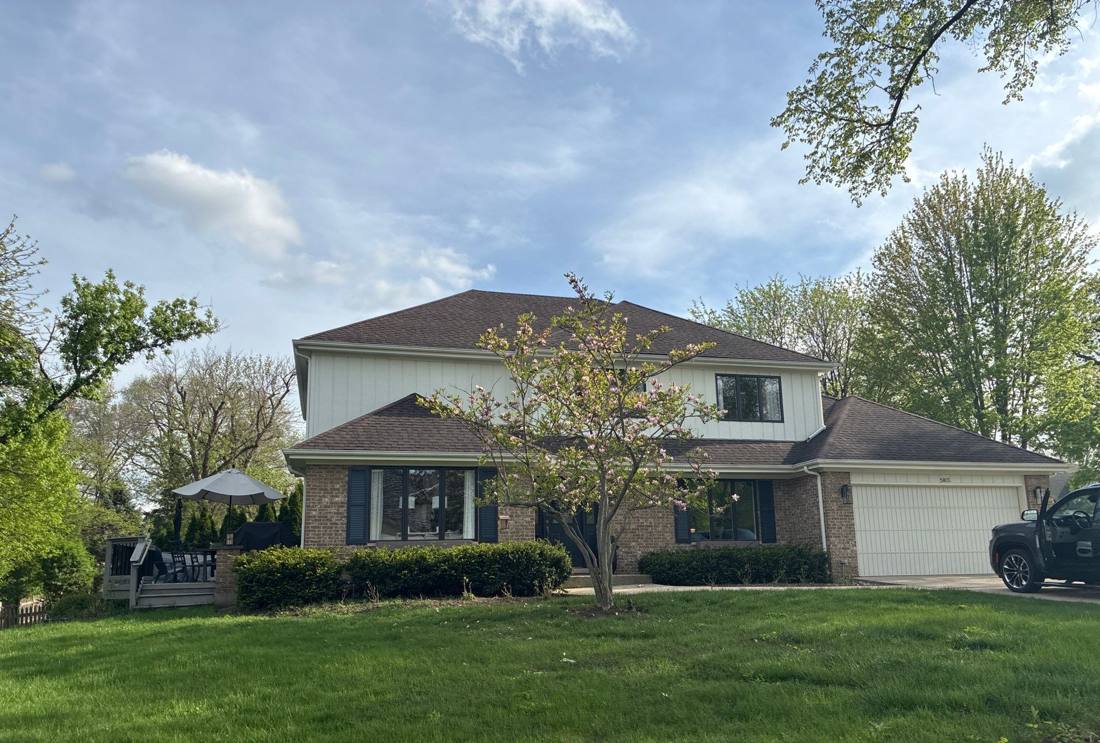 Two-story Hinsdale home photographed during a roof inspection, April 2026