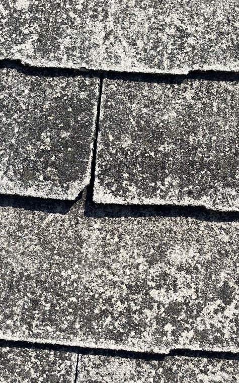 Close-up of the old slate-style shingles on St. Paul's Lutheran Church in St. James, MN, with cracks, broken edges and heavy lichen