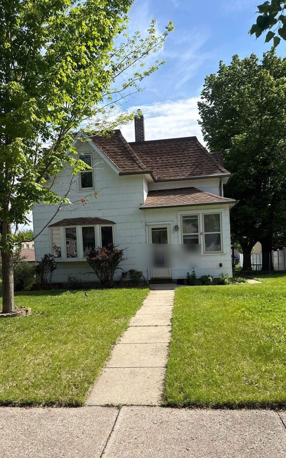Two-story home near North State Street in New Ulm, MN photographed by Repair King during a 2026 roof inspection
