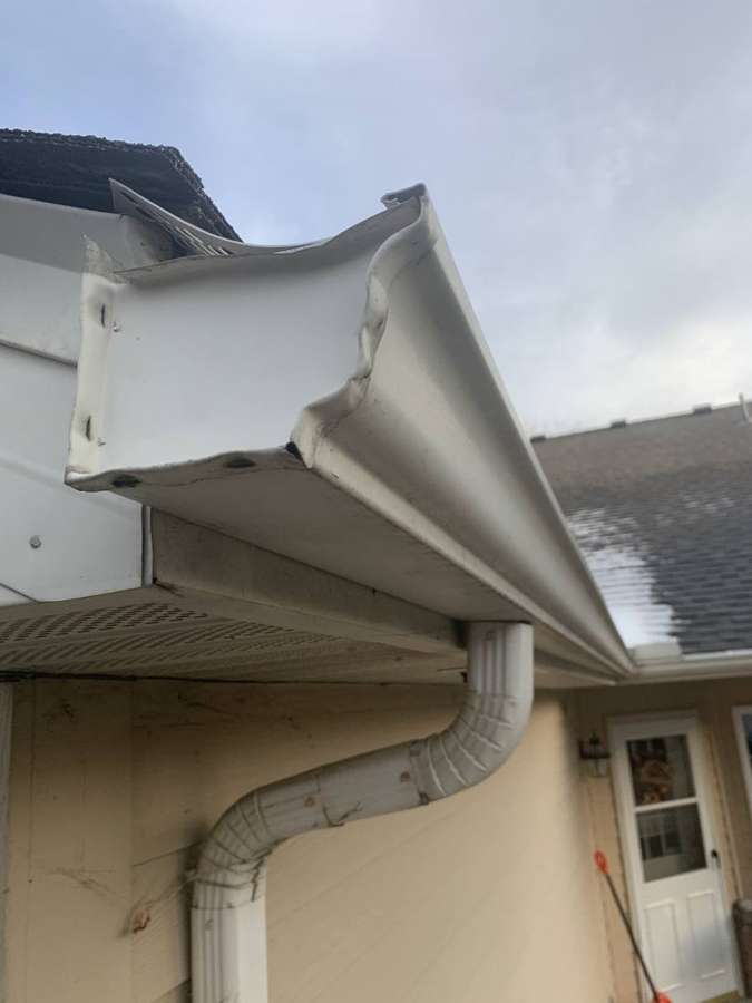 A gutter corner and downspout on a Penn Place townhome