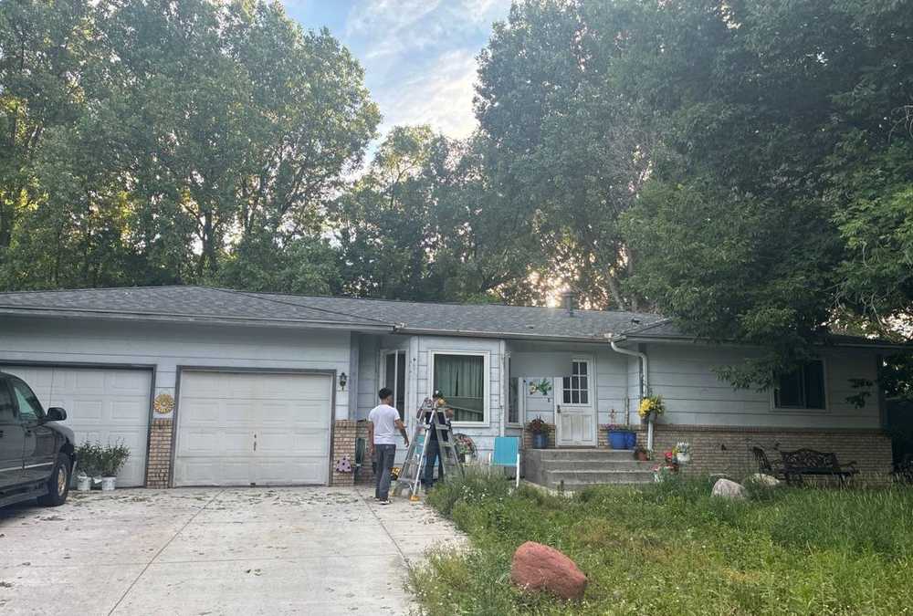 Repair King crew members working at an Oakdale home, June 2026