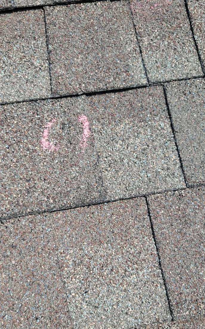 Chalk-marked hail hit on a Maplewood roof slope, August 2022