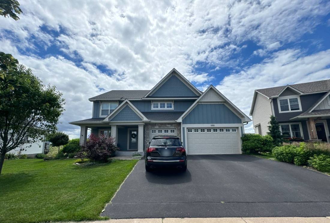 Two-story home in Woodbury, MN photographed by Repair King during a 2024 roof project