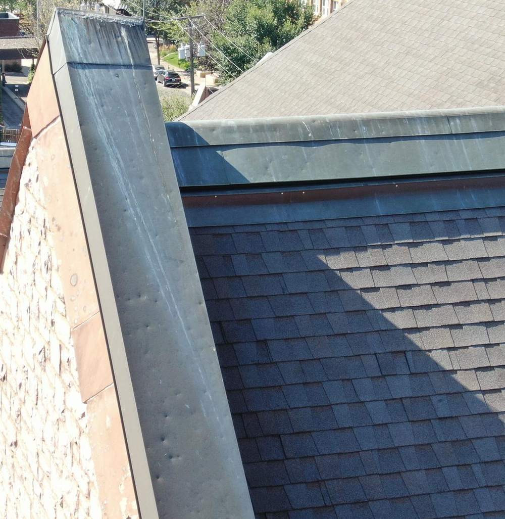 Hail dents in copper gable coping and ridge cap on the Scottish Rite Temple