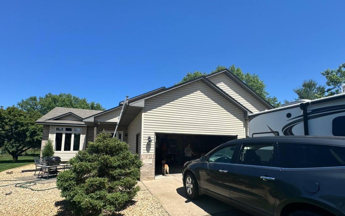 Ranch-style Oak Grove home with attached garage photographed during a roof inspection, June 2024