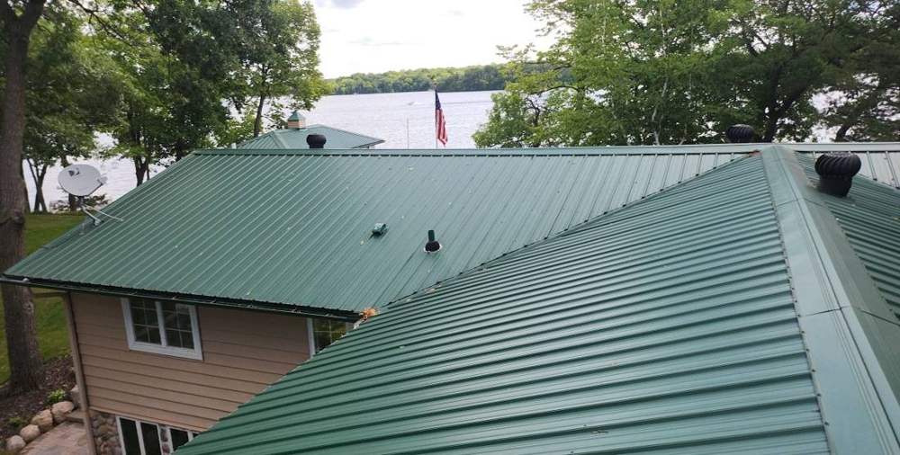 Standing-seam metal roof on a lake-area property near South Haven, July 2023