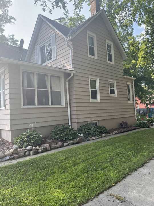 Side of an older story-and-a-half home with lap siding in New Prague, MN during a Repair King inspection, August 2021