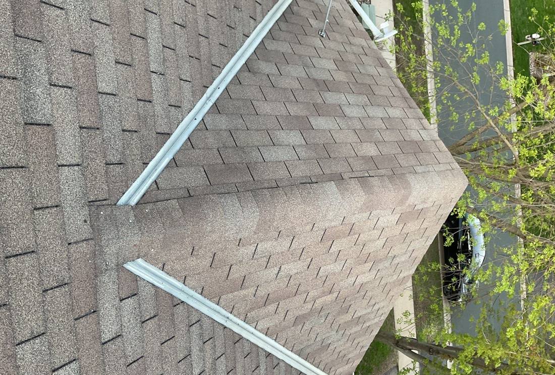 Aerial view down a Savage ridge line with a satellite dish mount, May 2023