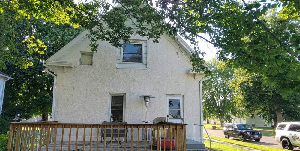 Two-story home in Bellechester photographed during a roof project, August 2024