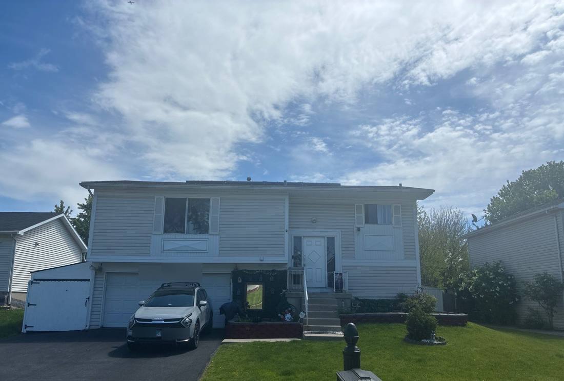 Split-level home in Bolingbrook photographed during a roof inspection, May 2026
