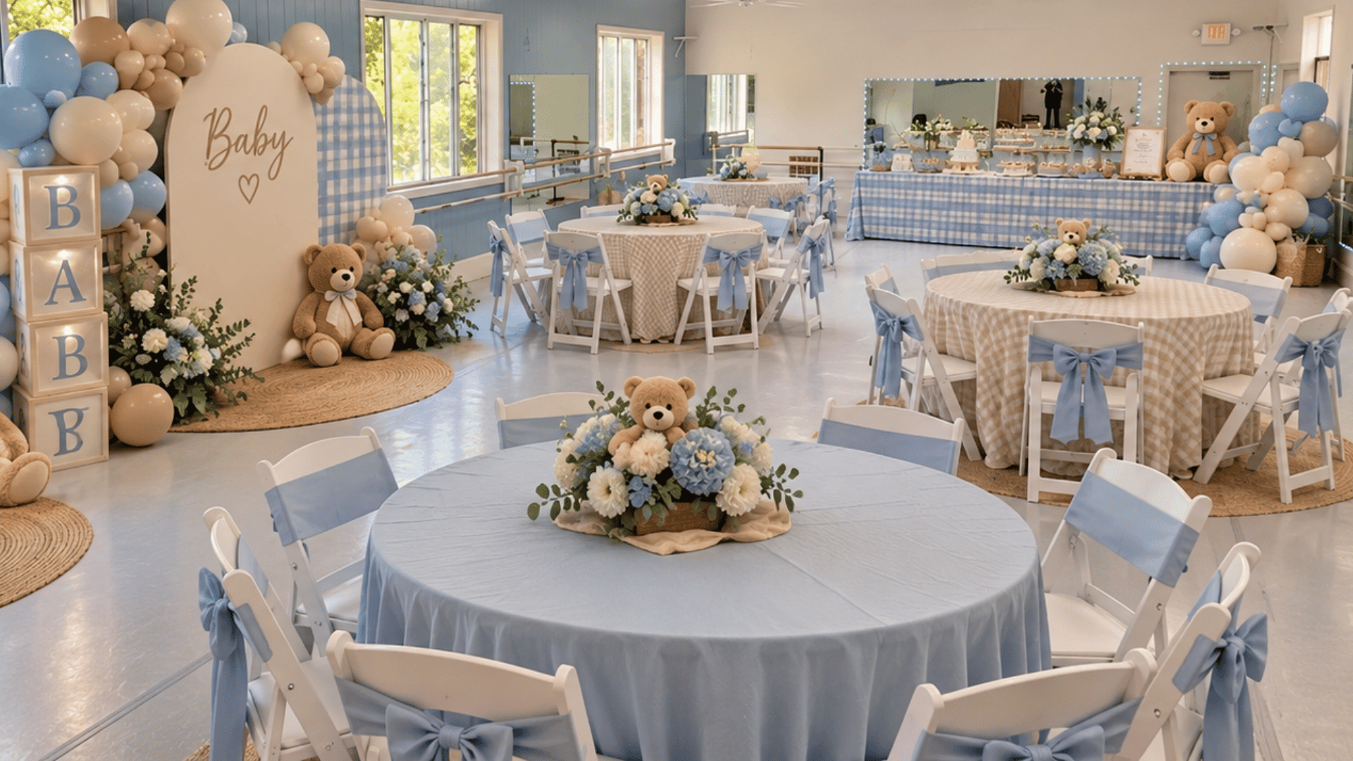 Baby shower decorations and seating arranged inside Prince William Dance Academy's Nokesville event space