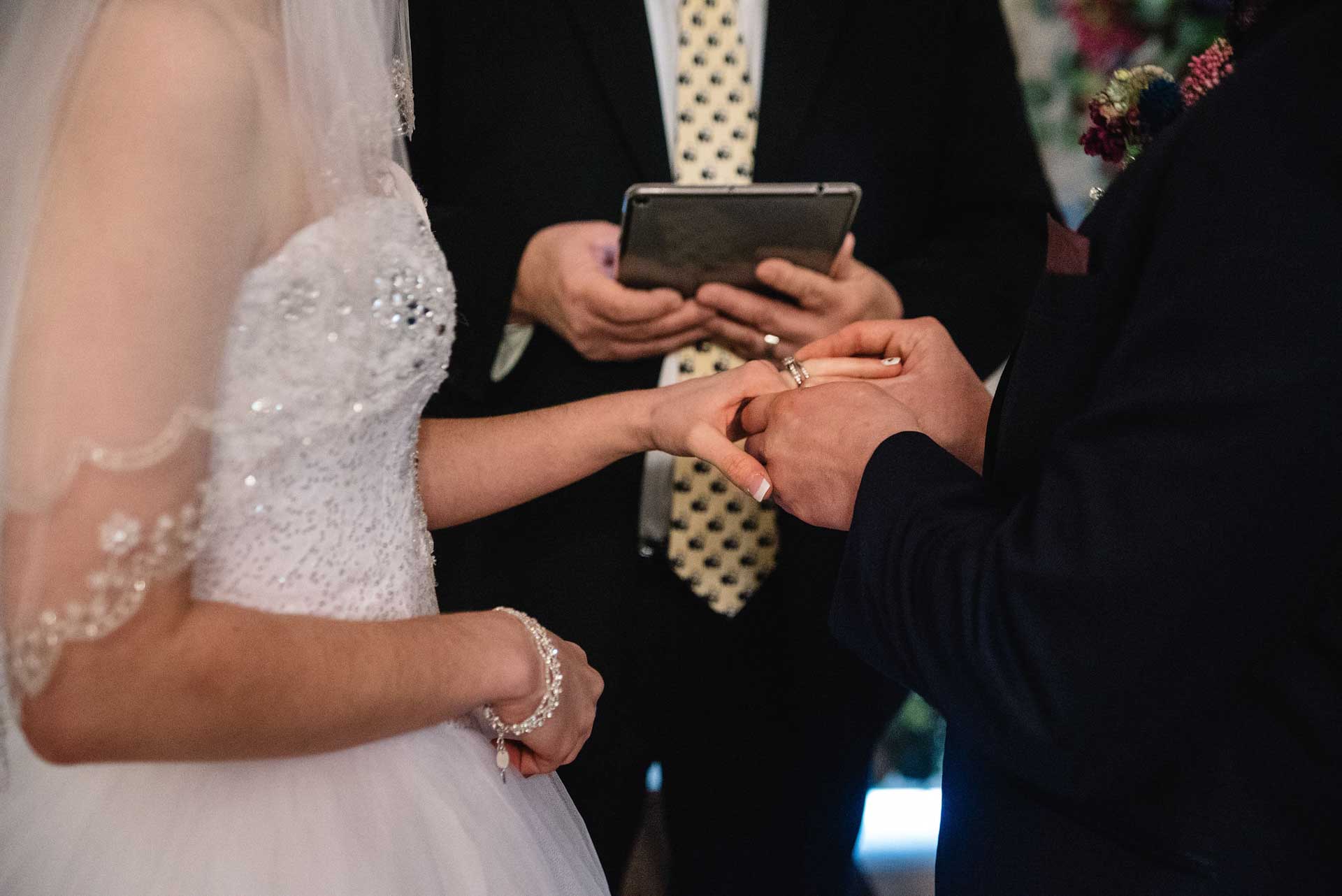 Hands holding wedding rings