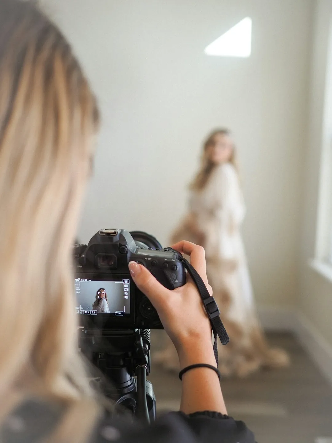 female photographer taking photos at a baby shower