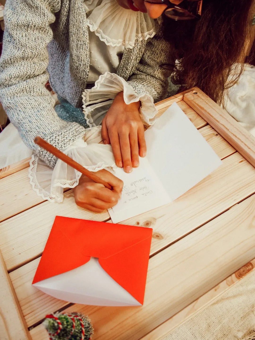 female writing thank you cards for her baby shower guests