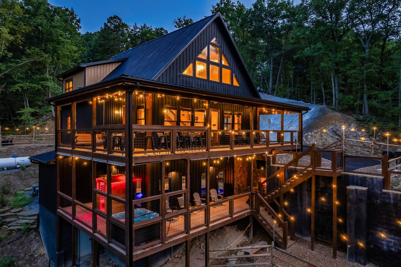 Onyx Lodge — rear exterior at night showing all three levels