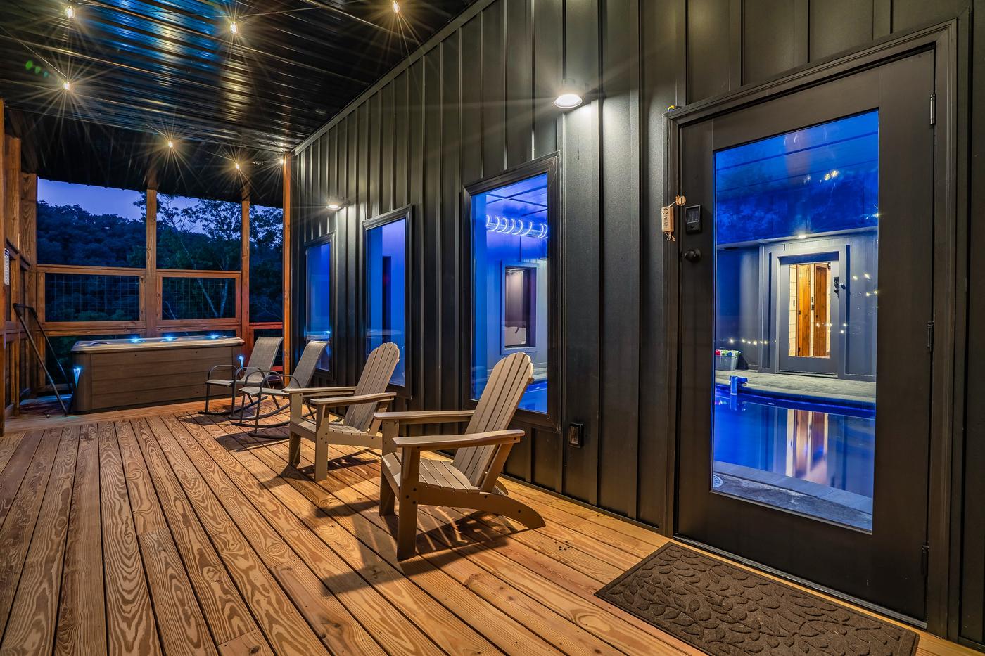 Lower deck — hot tub and sauna pod with blue ambient lighting