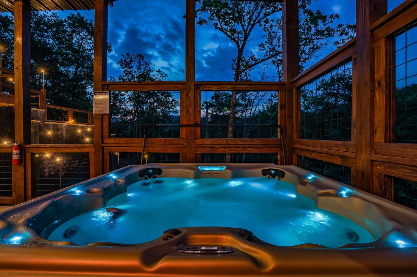 Covered hot tub alcove with wooded treetop views