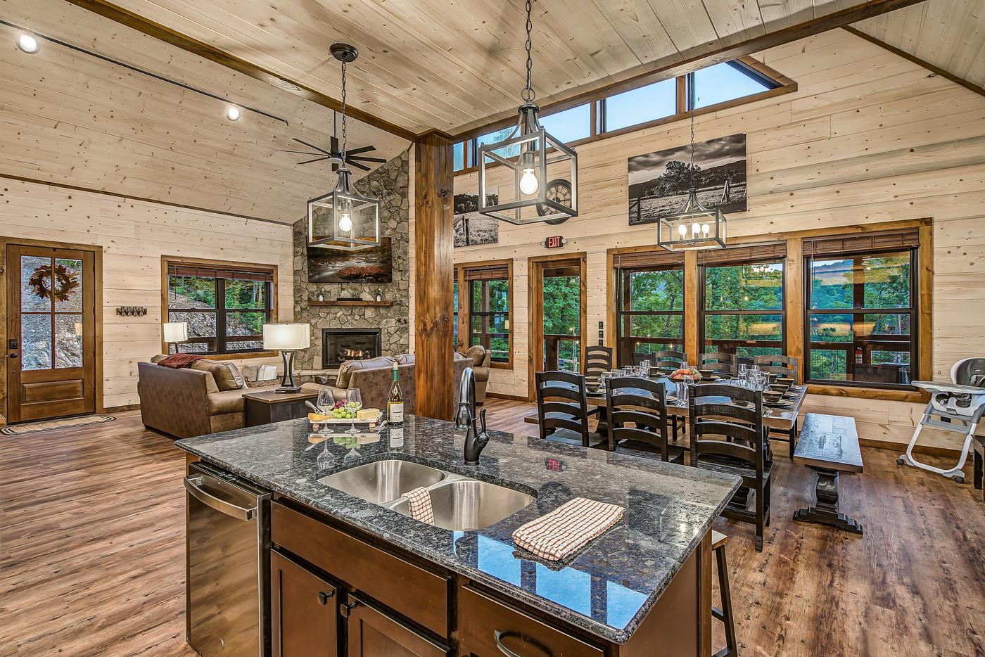 Kitchen — granite island, farmhouse sink, and dining for twelve