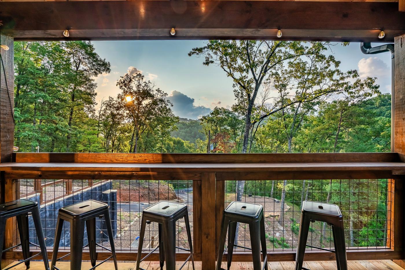 Upper deck bar seating with panoramic mountain views