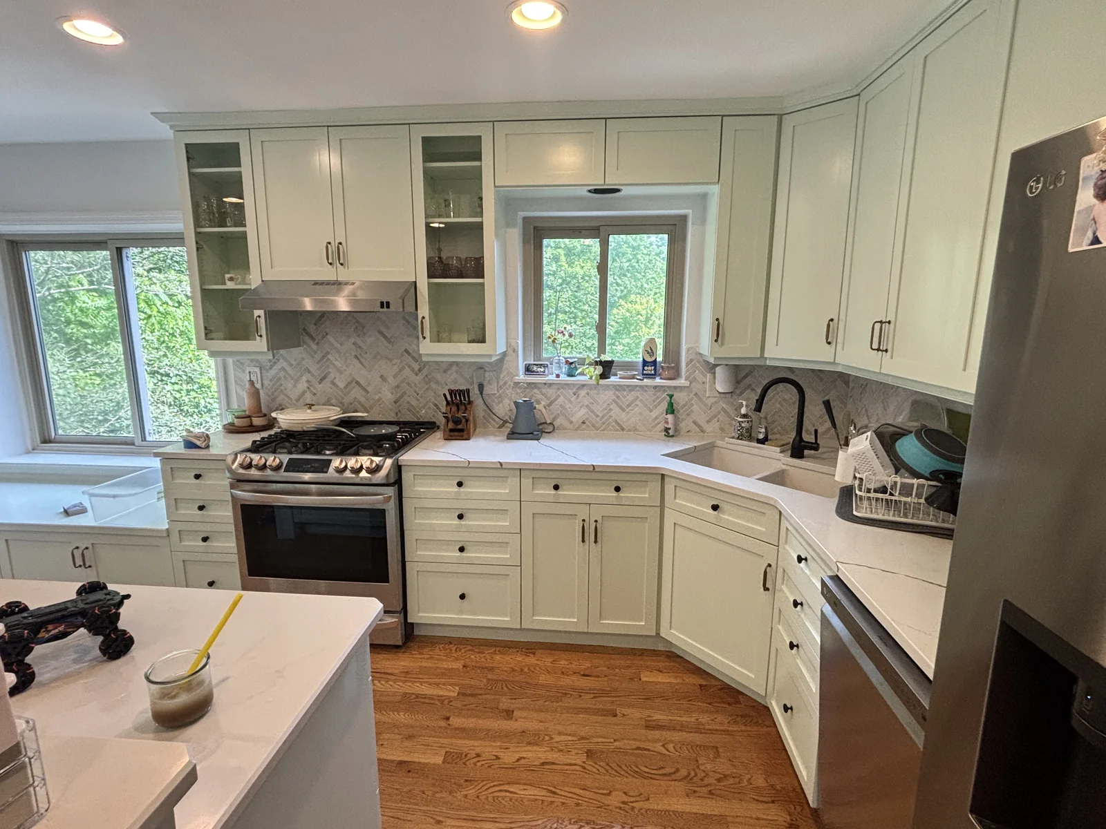 Completed kitchen cabinet refinishing project showing updated cabinetry, doors, and drawer fronts by Quality Painters