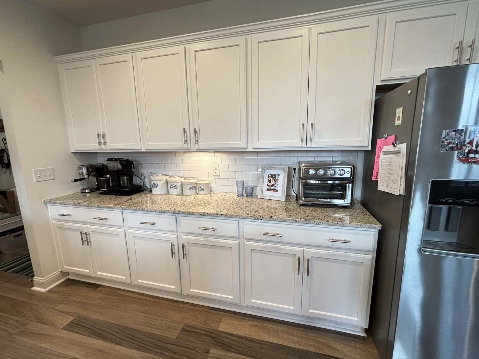 Painted kitchen cabinets with a chosen color and finish demonstrating cabinetry detail and clean lines