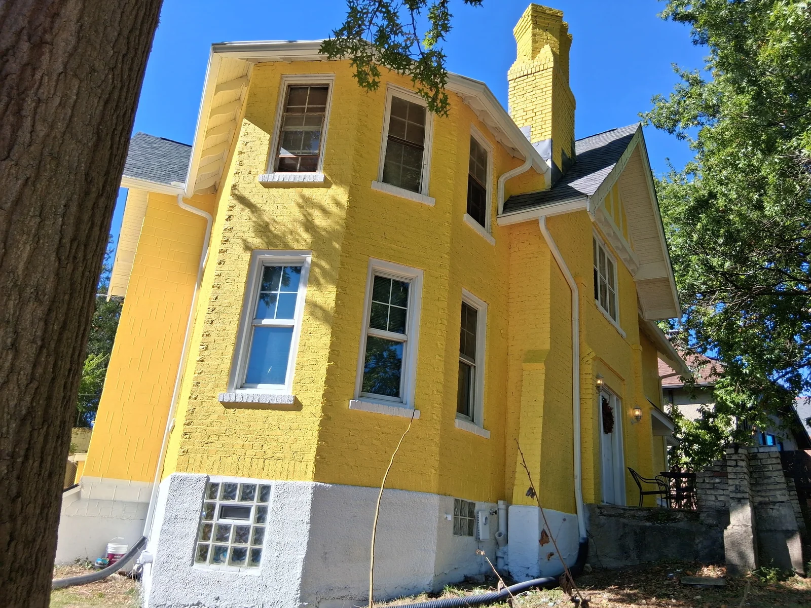 Exterior painting preparation with pressure washing and surface cleaning before painting
