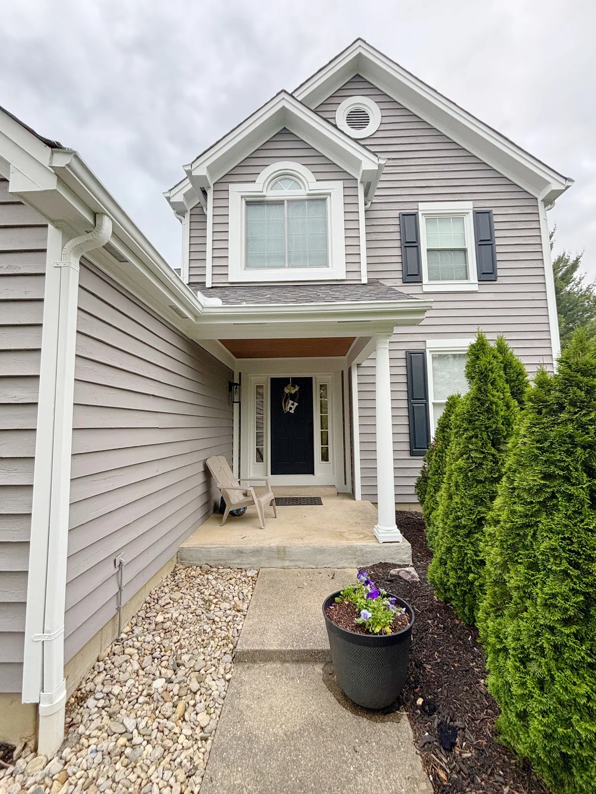 Exterior painted residential home with clean trim and siding